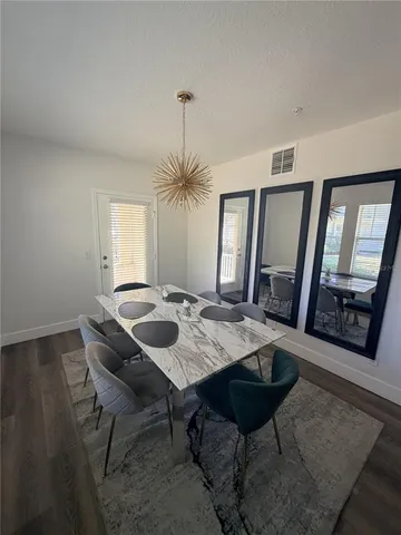 a view of a dining room with furniture