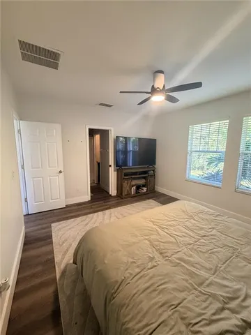 a bed room with a bed and a tv