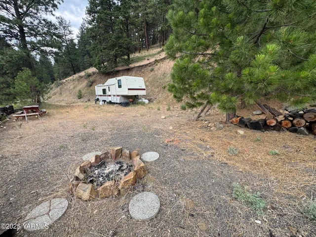 a car parked in the middle of a field