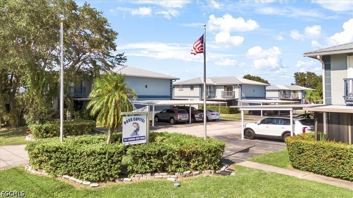 707 Hoover Dike Road, Unit 904 Clewiston, FL 33440 - Photo 39 of 41 a swimming pool with outdoor seating and yard