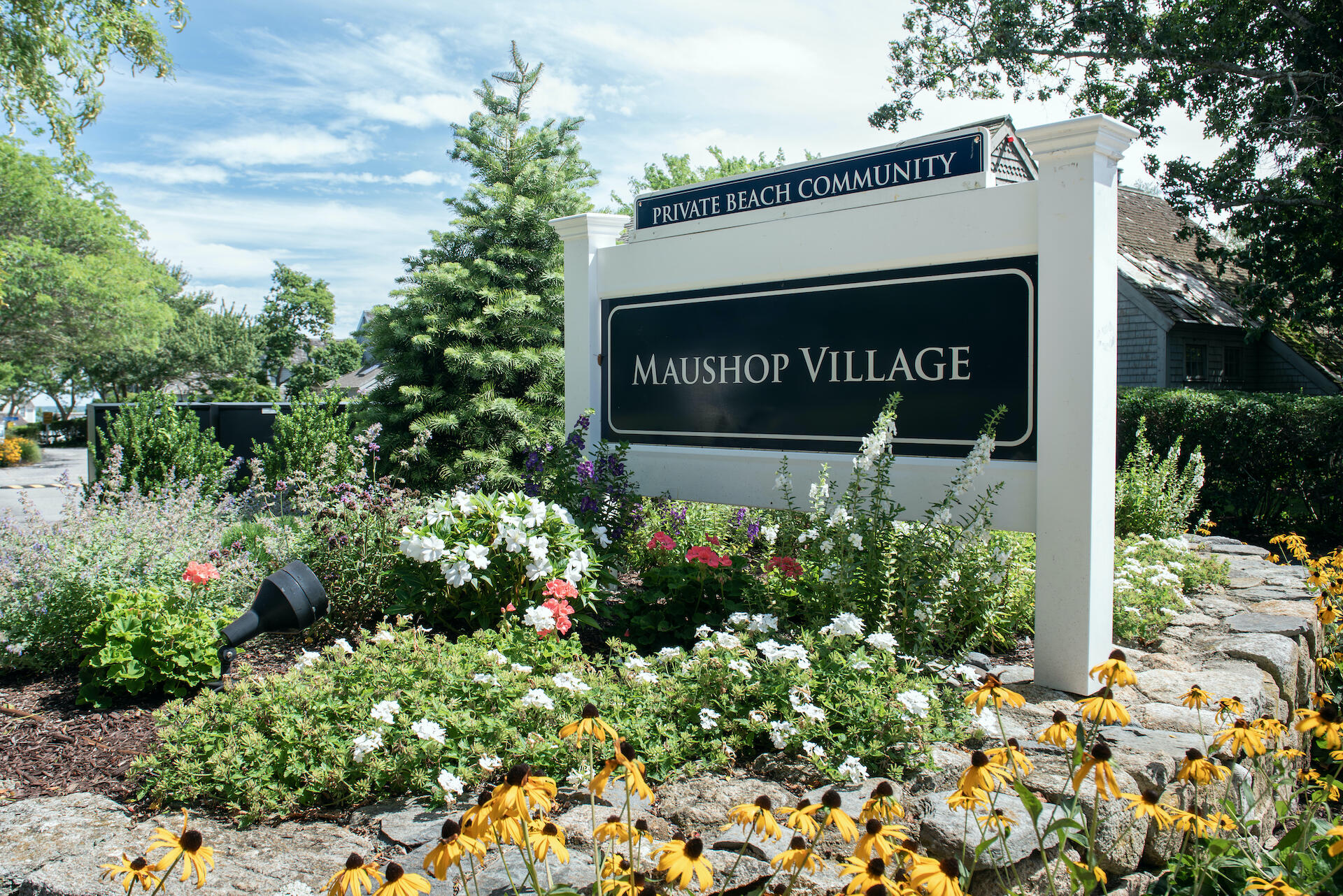 3 Hydrangea Lane Mashpee, MA 02649 - Photo 15 of 18 a sign that is in front of flowers