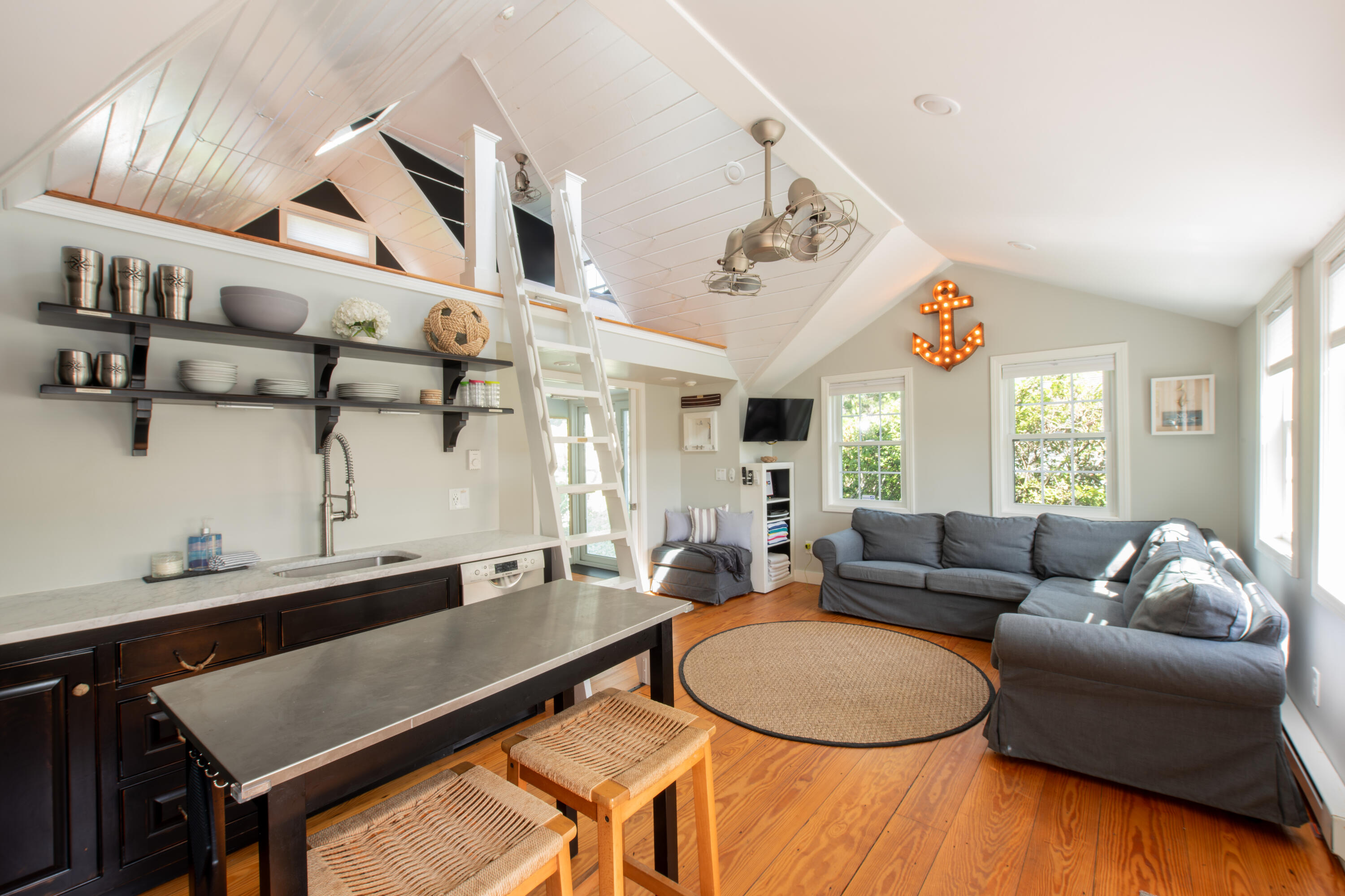 3 Hydrangea Lane Mashpee, MA 02649 - Photo 4 of 18 a living room with furniture a large window and a chandelier