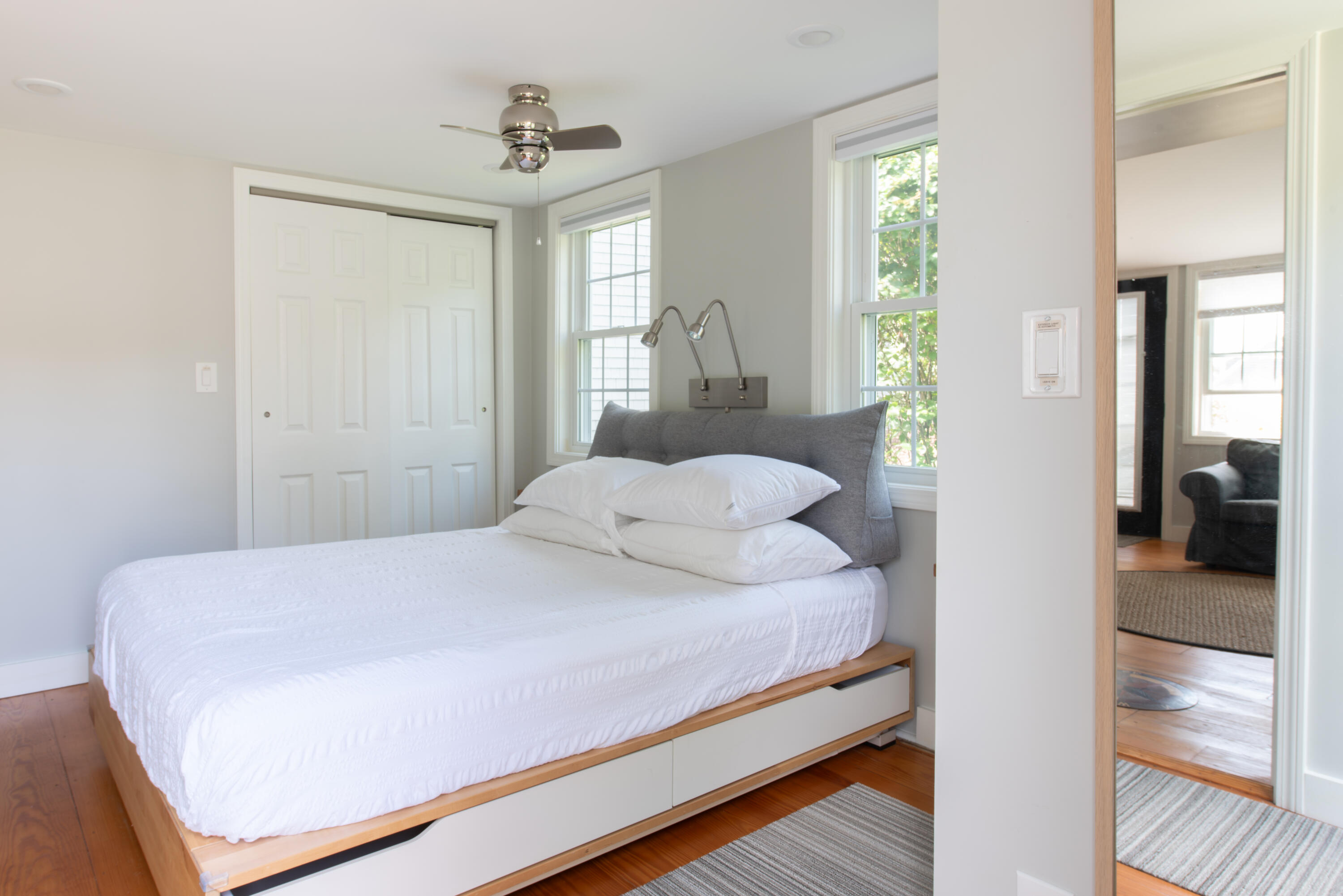 3 Hydrangea Lane Mashpee, MA 02649 - Photo 6 of 18 a bedroom with a large bed and a chandelier