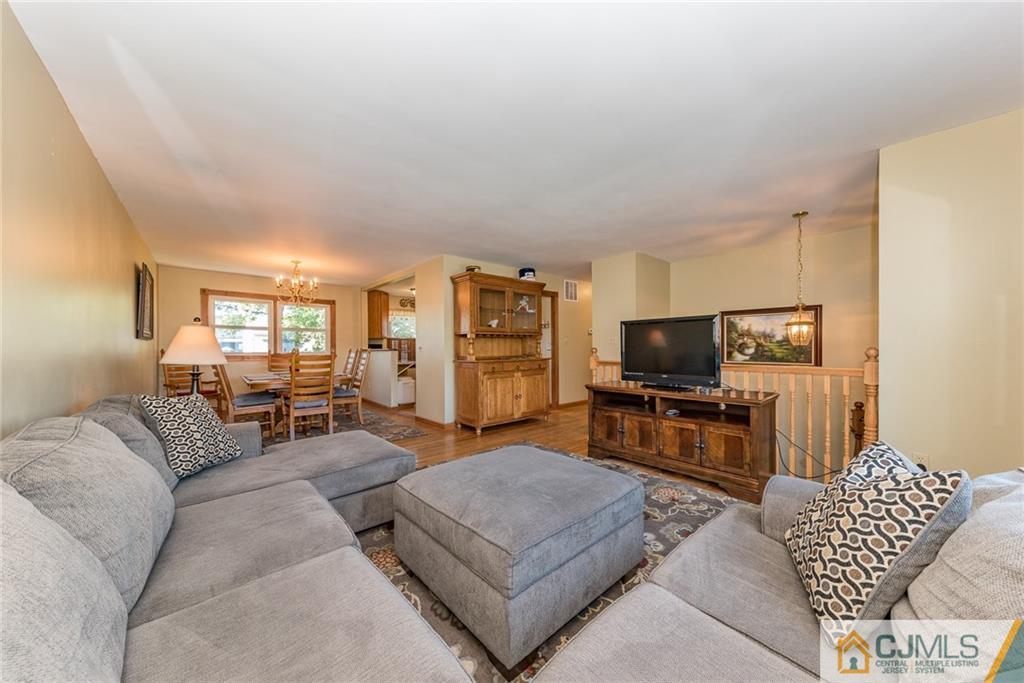 2115 Edgar Road Point Pleasant, NJ 08742 - Photo 5 of 24 a living room with furniture and a flat screen tv