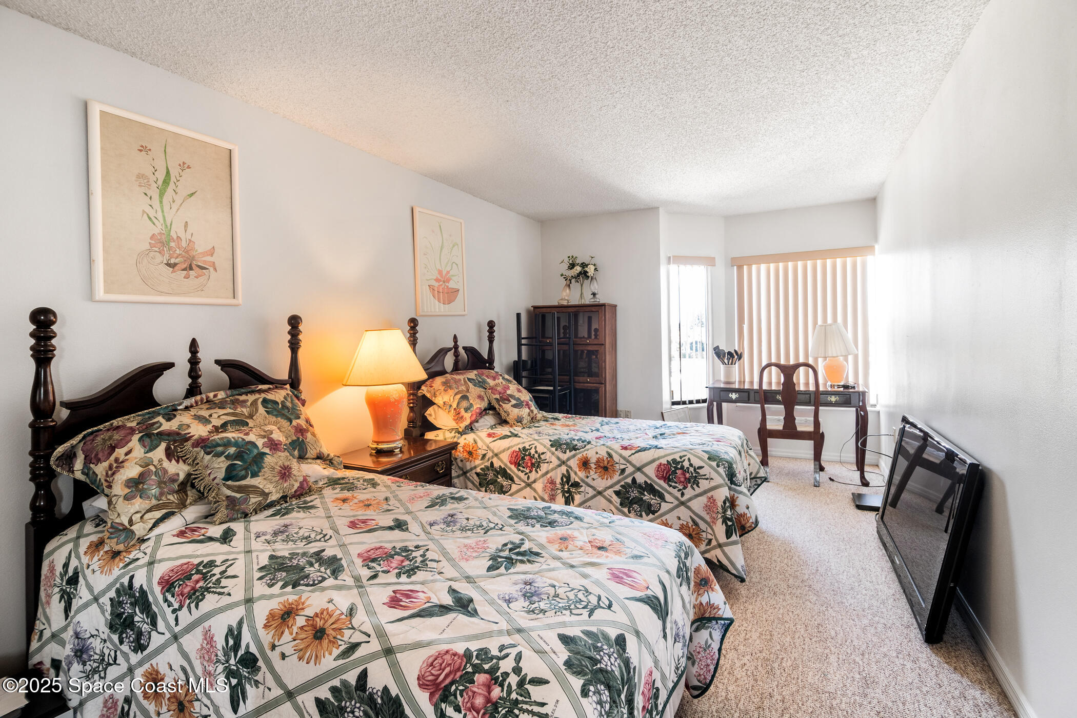6770 Ridgewood Avenue, Unit 301 Cocoa Beach, FL 32931 - Photo 20 of 44 a bedroom with bed and furniture