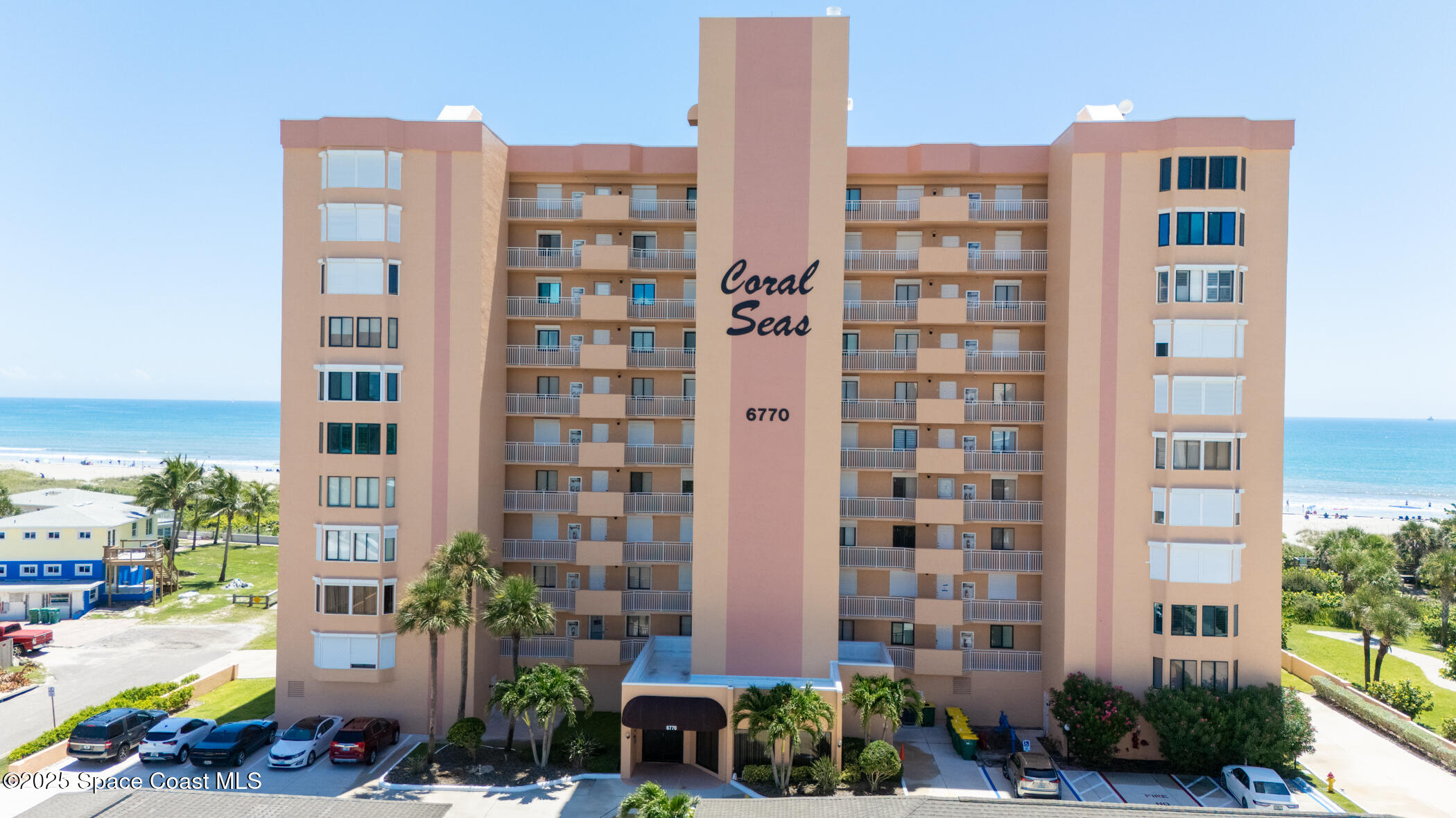6770 Ridgewood Avenue, Unit 301 Cocoa Beach, FL 32931 - Photo 2 of 44 a front view of a building