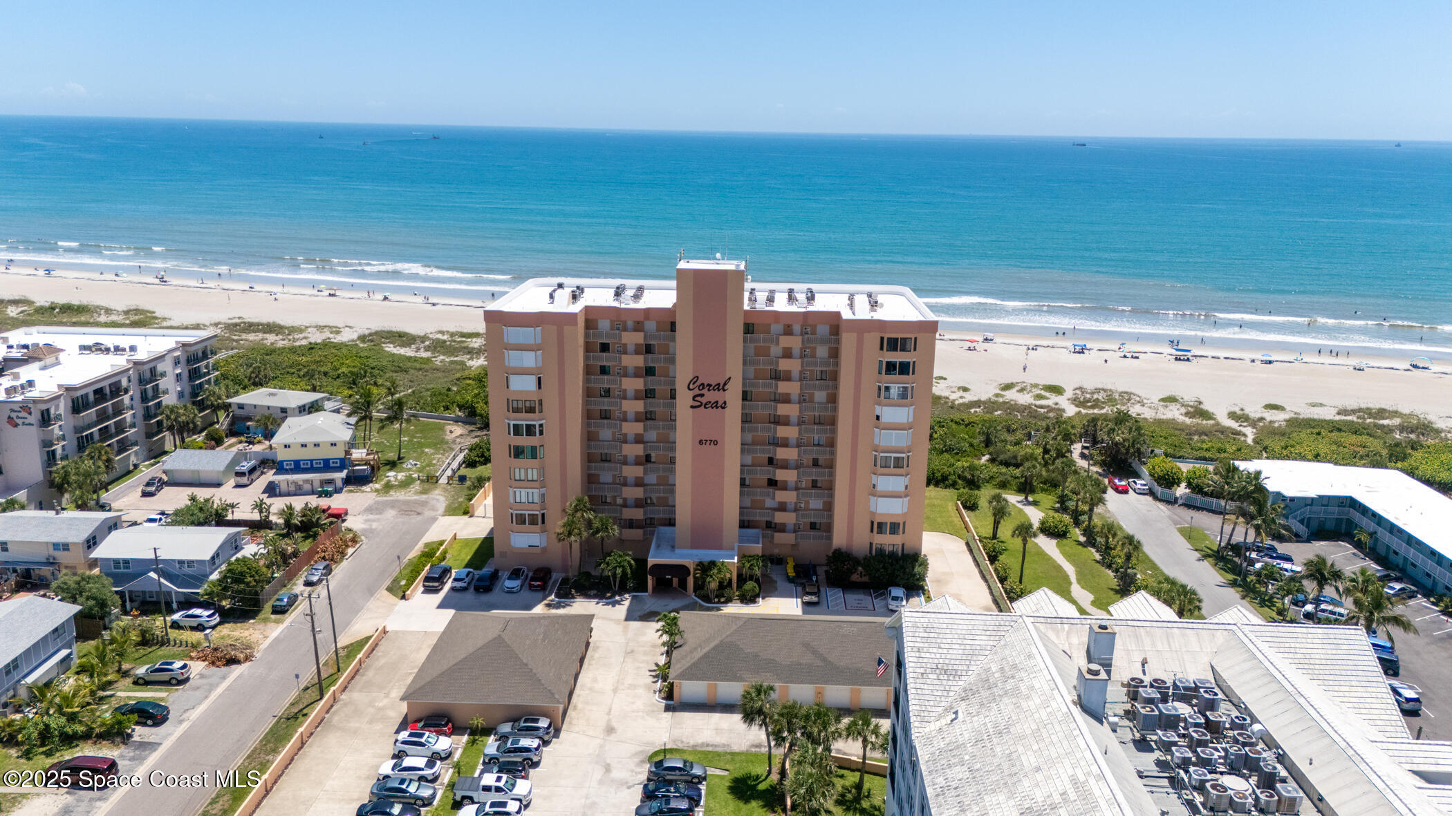 6770 Ridgewood Avenue, Unit 301 Cocoa Beach, FL 32931 - Photo 33 of 44 a view of a city with an ocean view