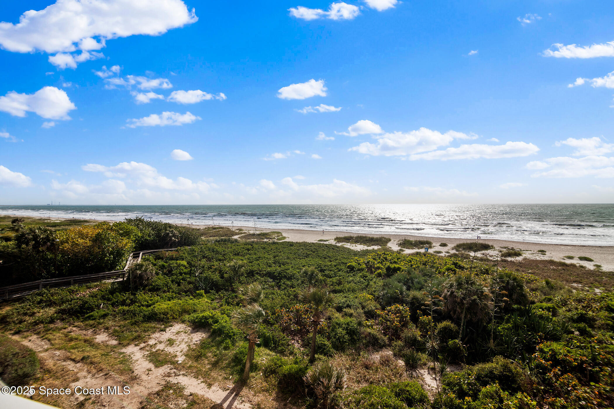 6770 Ridgewood Avenue, Unit 301 Cocoa Beach, FL 32931 - Photo 34 of 44 a view of a city with lots of bushes
