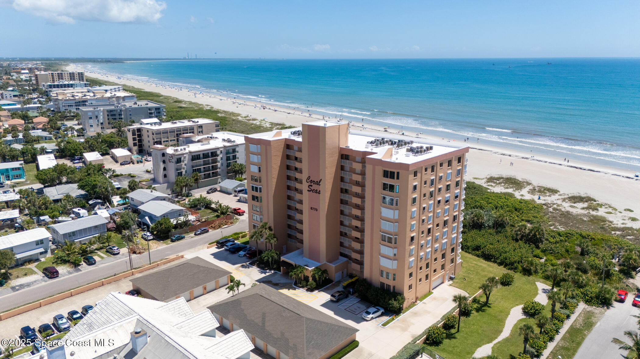 6770 Ridgewood Avenue, Unit 301 Cocoa Beach, FL 32931 - Photo 41 of 44 a view of a city with tall buildings