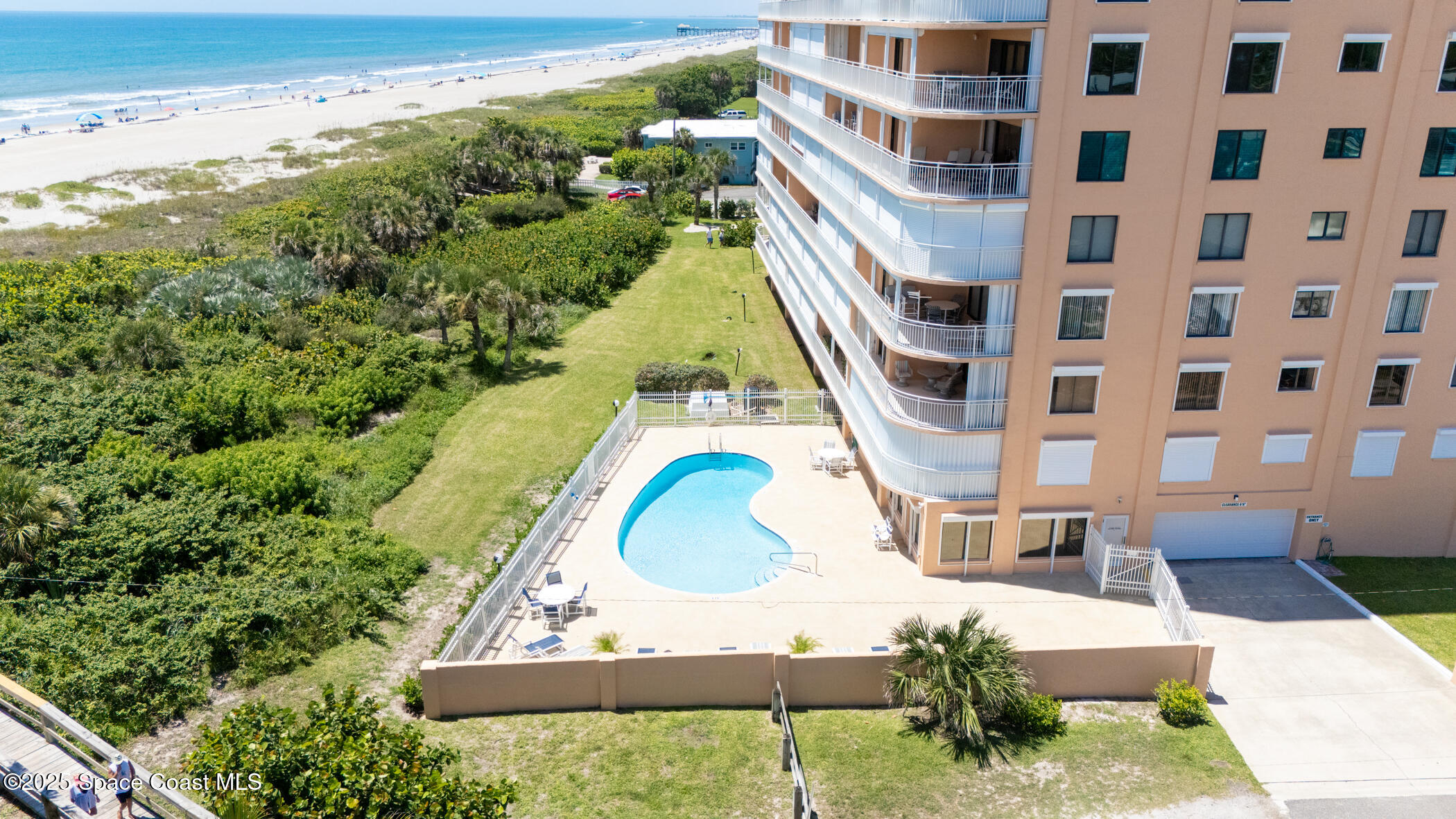 6770 Ridgewood Avenue, Unit 301 Cocoa Beach, FL 32931 - Photo 44 of 44 a view of building with yard