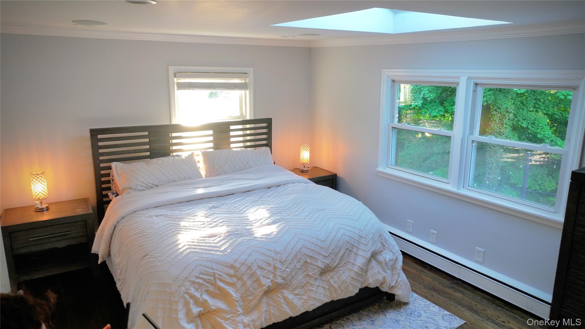522 Moriches Road St. James, NY 11780 - Photo 32 of 49 a large bed sitting in a bedroom next to a window
