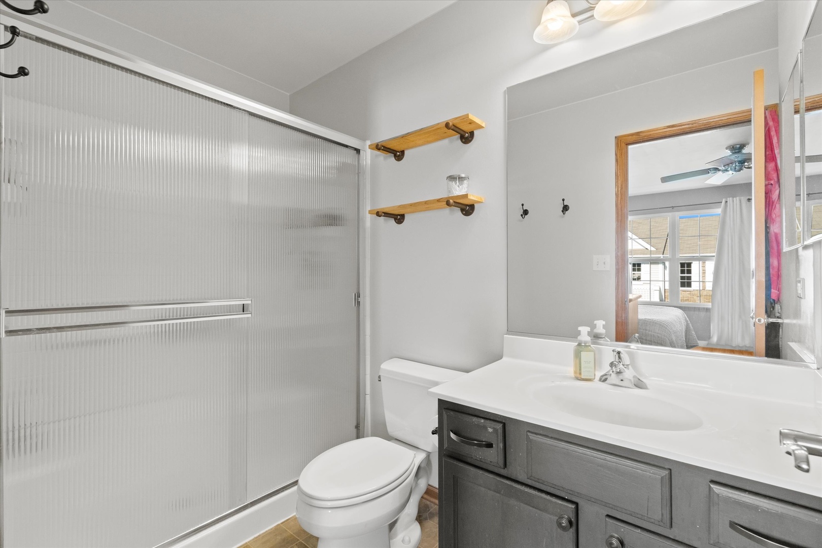 894 Clover Lane Pingree Grove, IL 60140 - Photo 12 of 24 a bathroom with a sink a toilet and shower