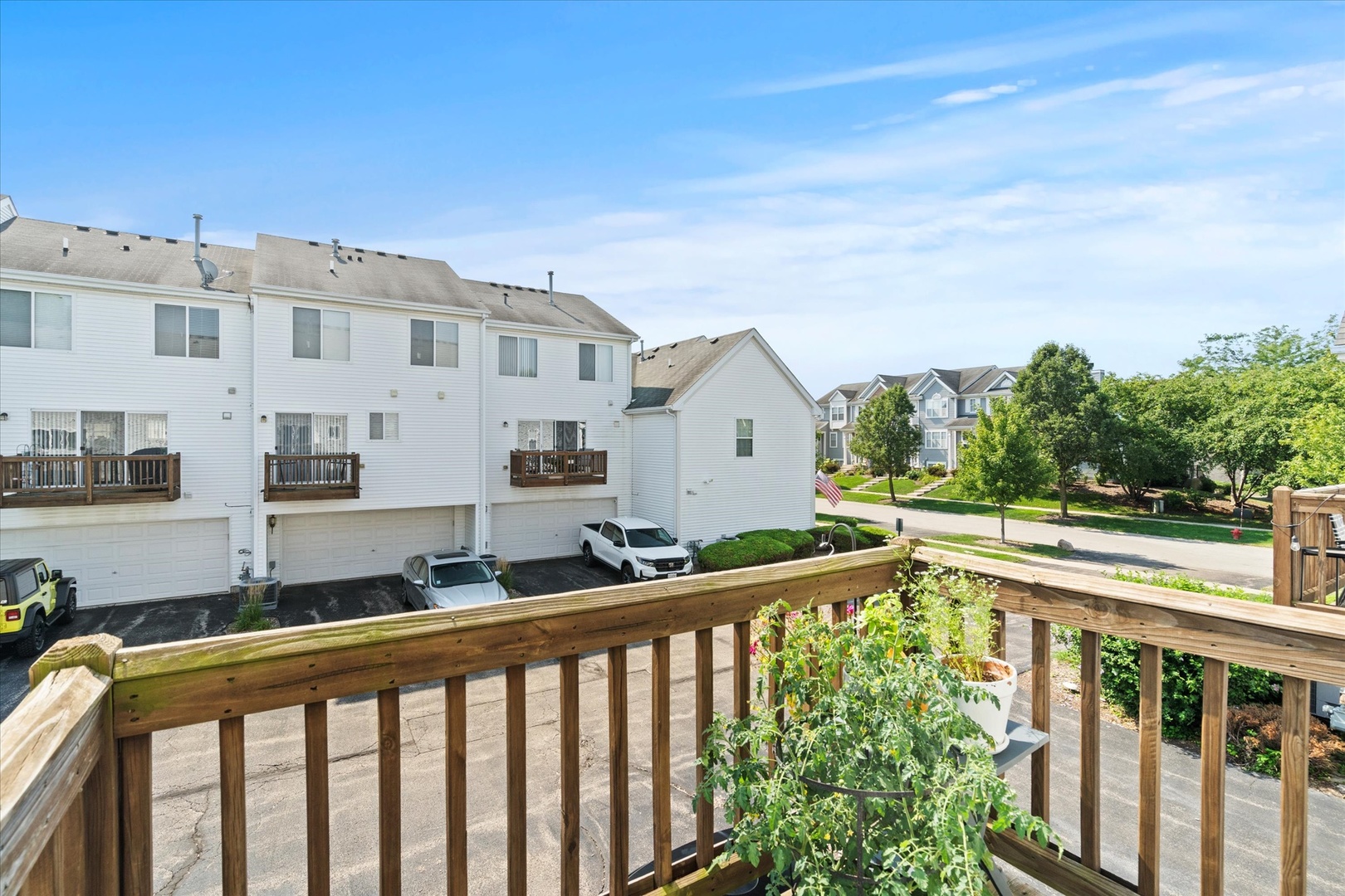894 Clover Lane Pingree Grove, IL 60140 - Photo 19 of 24 a view of a white house with a balcony