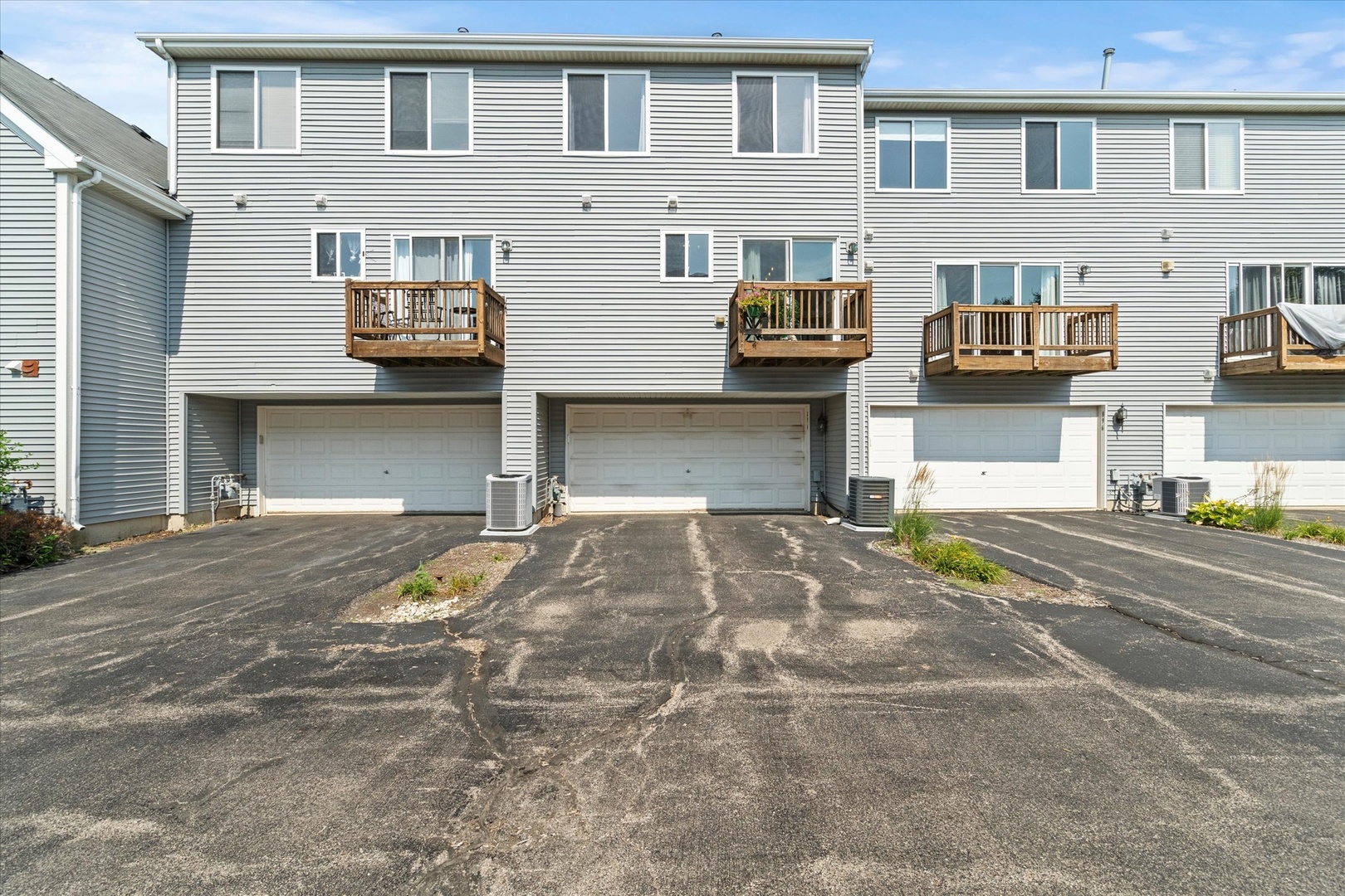 894 Clover Lane Pingree Grove, IL 60140 - Photo 20 of 24 a front view of a house with a parking space