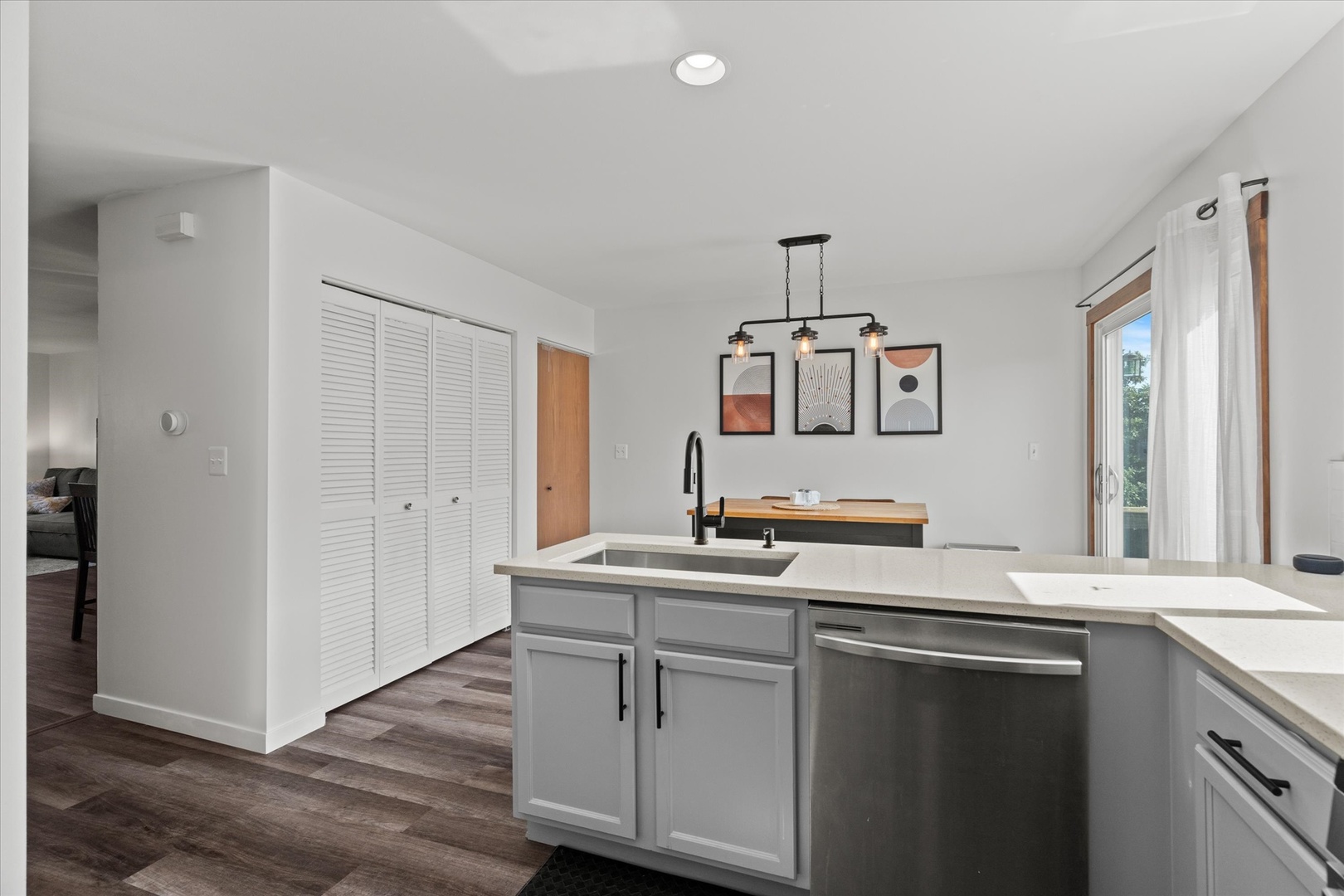 894 Clover Lane Pingree Grove, IL 60140 - Photo 6 of 24 a kitchen with a sink cabinets and wooden floor