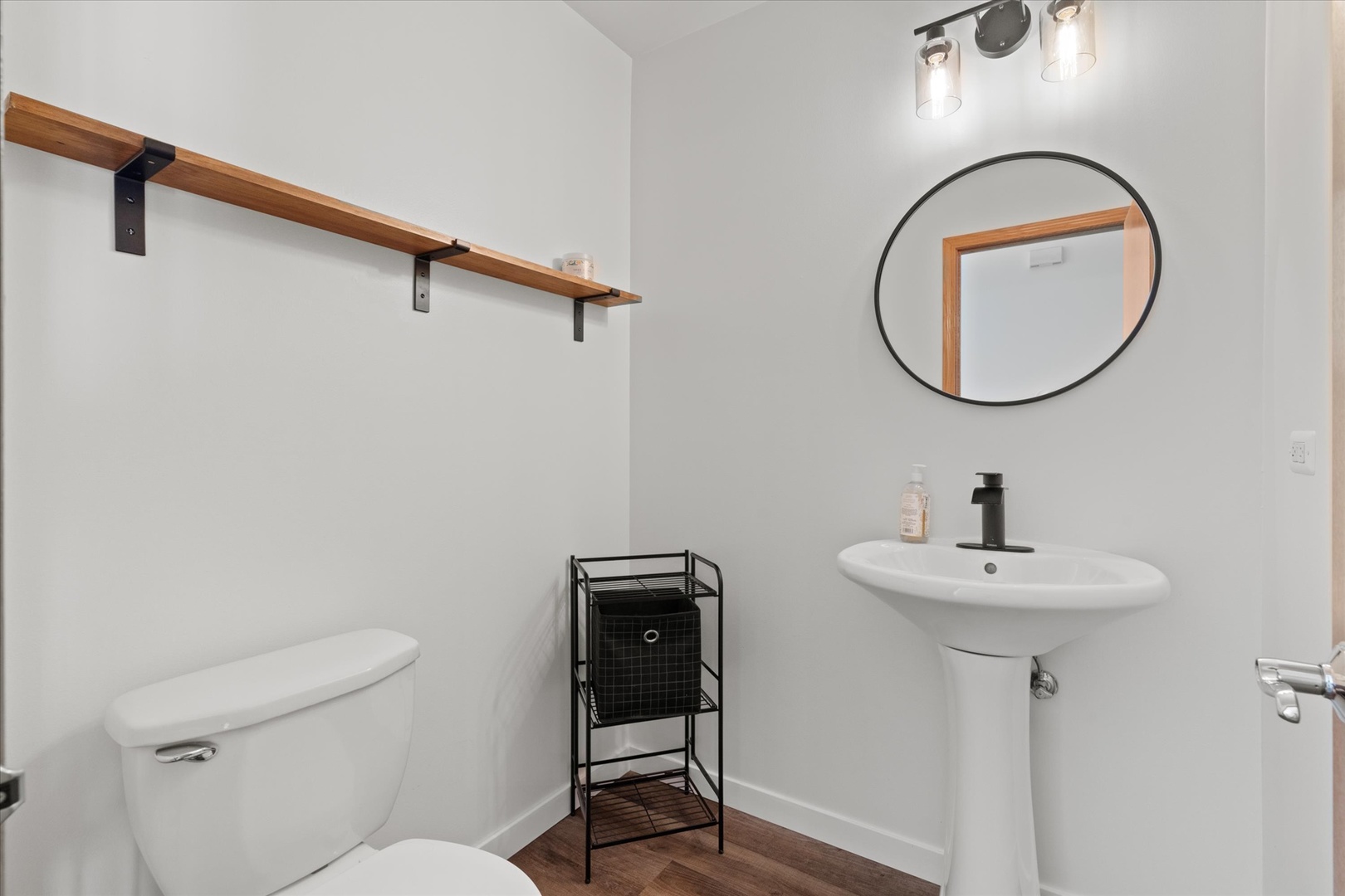 894 Clover Lane Pingree Grove, IL 60140 - Photo 9 of 24 a bathroom with a toilet a sink and a mirror