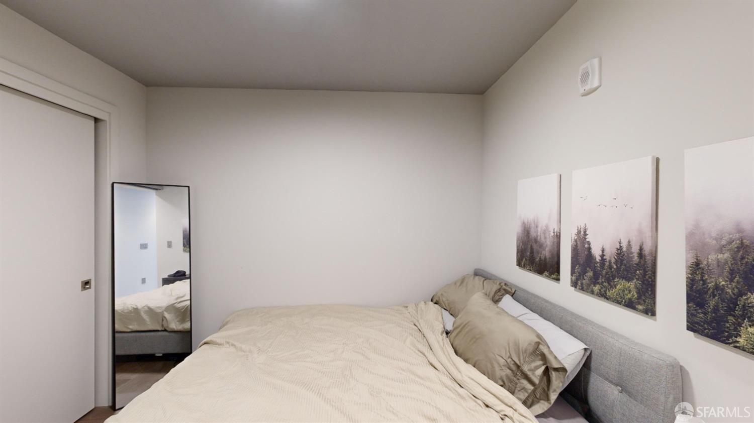 1238 Sutter Street, Unit 303 San Francisco, CA 94109 - Photo 10 of 15 a room with a bed and large window