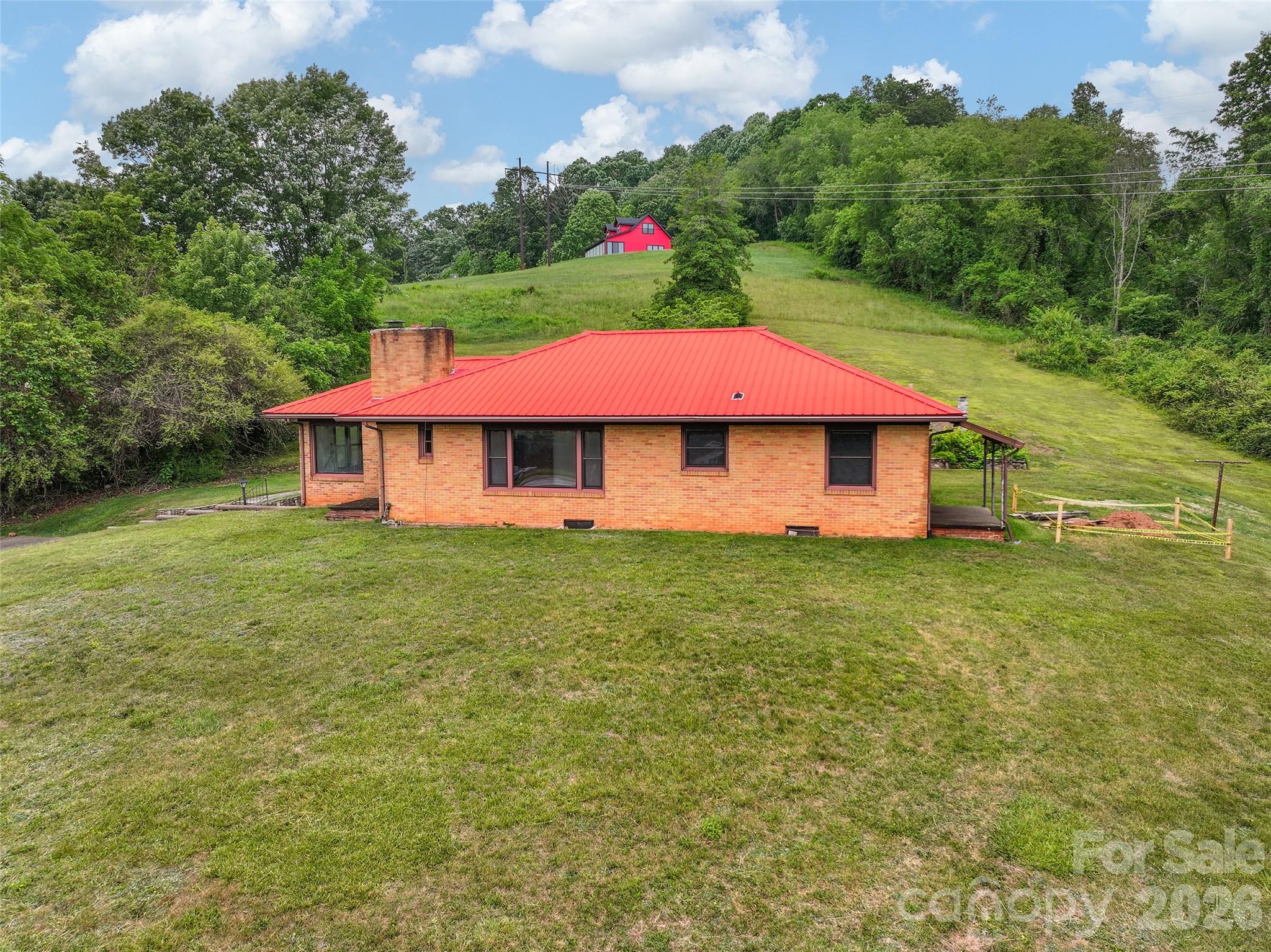 21 Beaverdam Road Canton, NC 28716 - Photo 3 of 24 a view of a house with a yard and sitting area