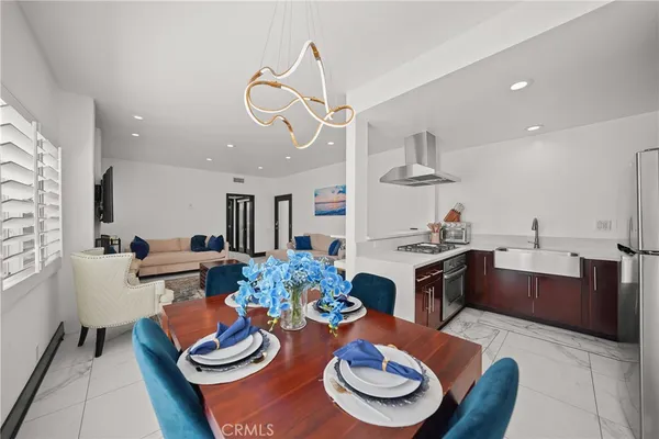 a dining room with furniture and wooden floor