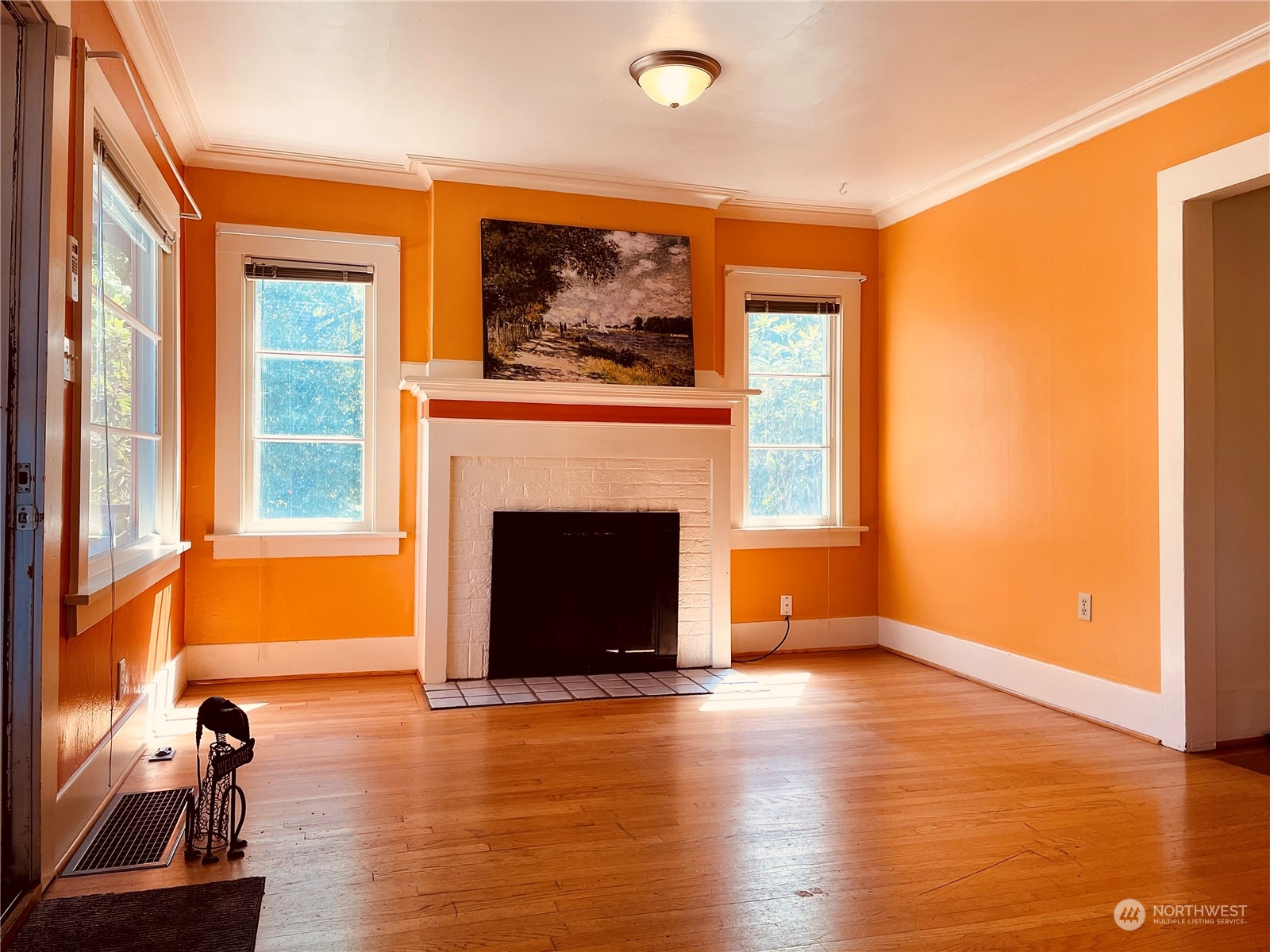 825 Northeast 63rd Street Seattle, WA 98115 - Photo 2 of 12 a view of a livingroom with a fireplace and window