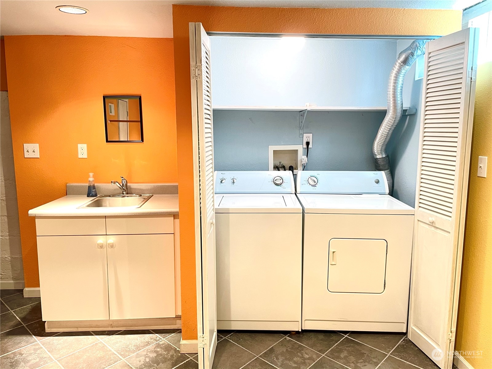 825 Northeast 63rd Street Seattle, WA 98115 - Photo 9 of 12 a utility room with dryer and washer