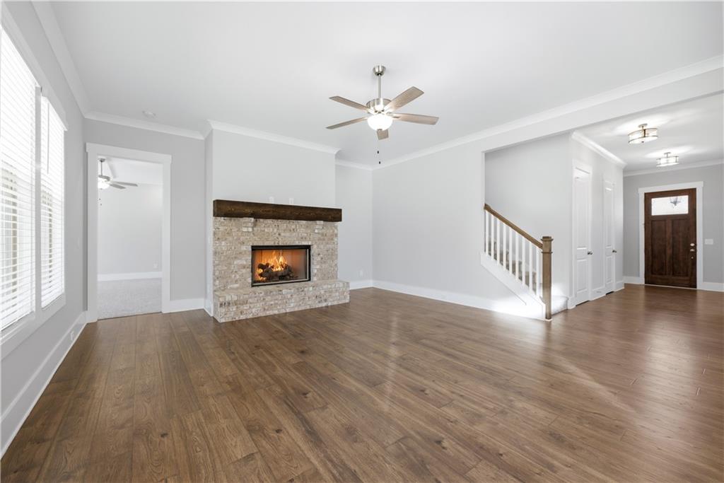 5706 Meadow View Drive Jefferson, GA 30549 - Photo 11 of 47 a view of an empty room with wooden floor and a window