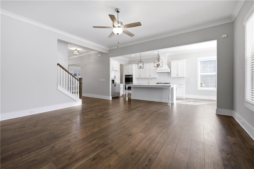 5706 Meadow View Drive Jefferson, GA 30549 - Photo 13 of 47 a view of kitchen with sink microwave and wooden floor