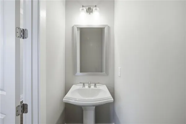 a bathroom with a sink and mirror