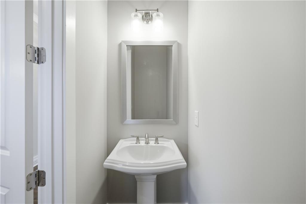 5706 Meadow View Drive Jefferson, GA 30549 - Photo 20 of 47 a bathroom with a sink and mirror
