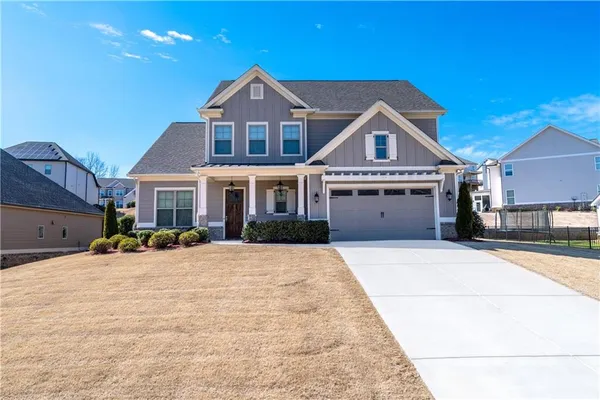 a front view of a house with yard
