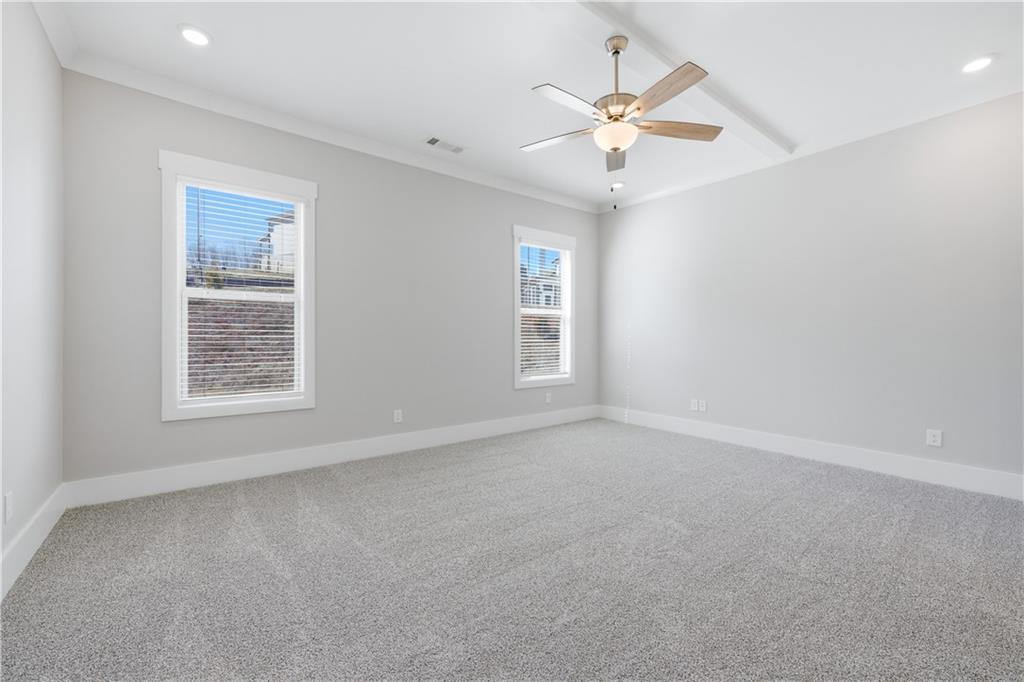 5706 Meadow View Drive Jefferson, GA 30549 - Photo 22 of 47 an empty room with a window and a fan