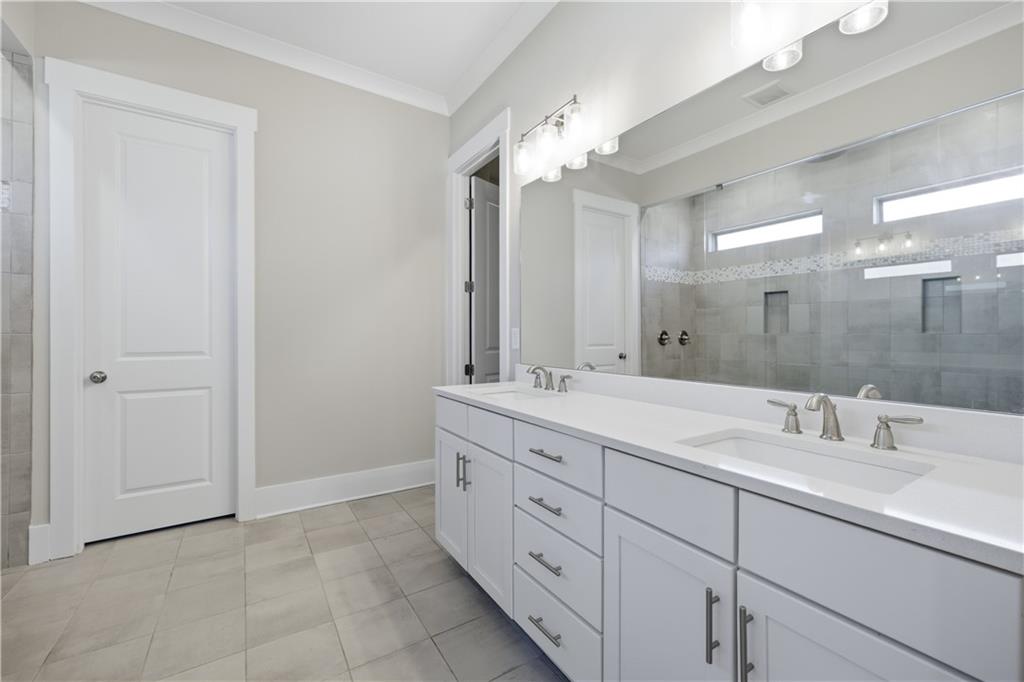 5706 Meadow View Drive Jefferson, GA 30549 - Photo 24 of 47 a bathroom with a double vanity sink mirror and