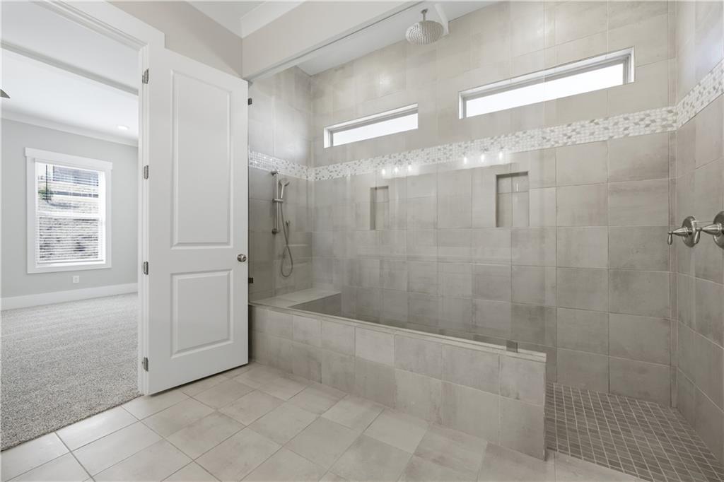 5706 Meadow View Drive Jefferson, GA 30549 - Photo 25 of 47 a bathroom with a bathtub and shower
