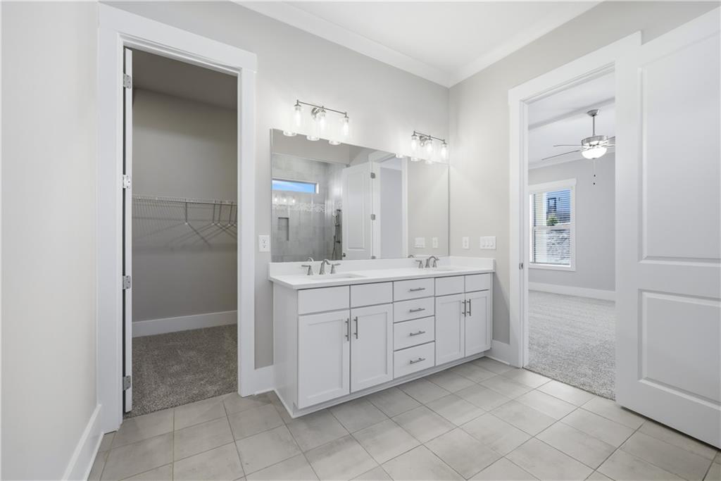 5706 Meadow View Drive Jefferson, GA 30549 - Photo 27 of 47 a spacious bathroom with a mirror a shower and a sink