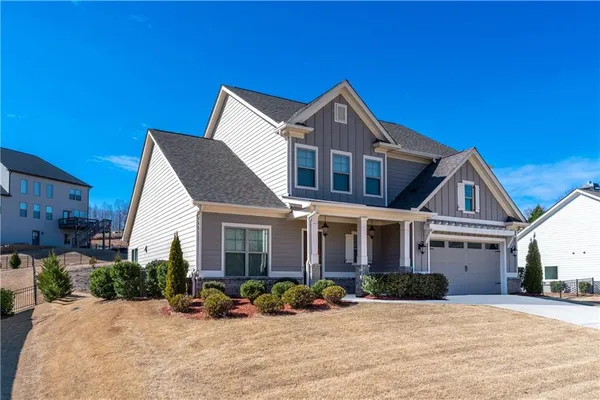 a front view of a house with a yard