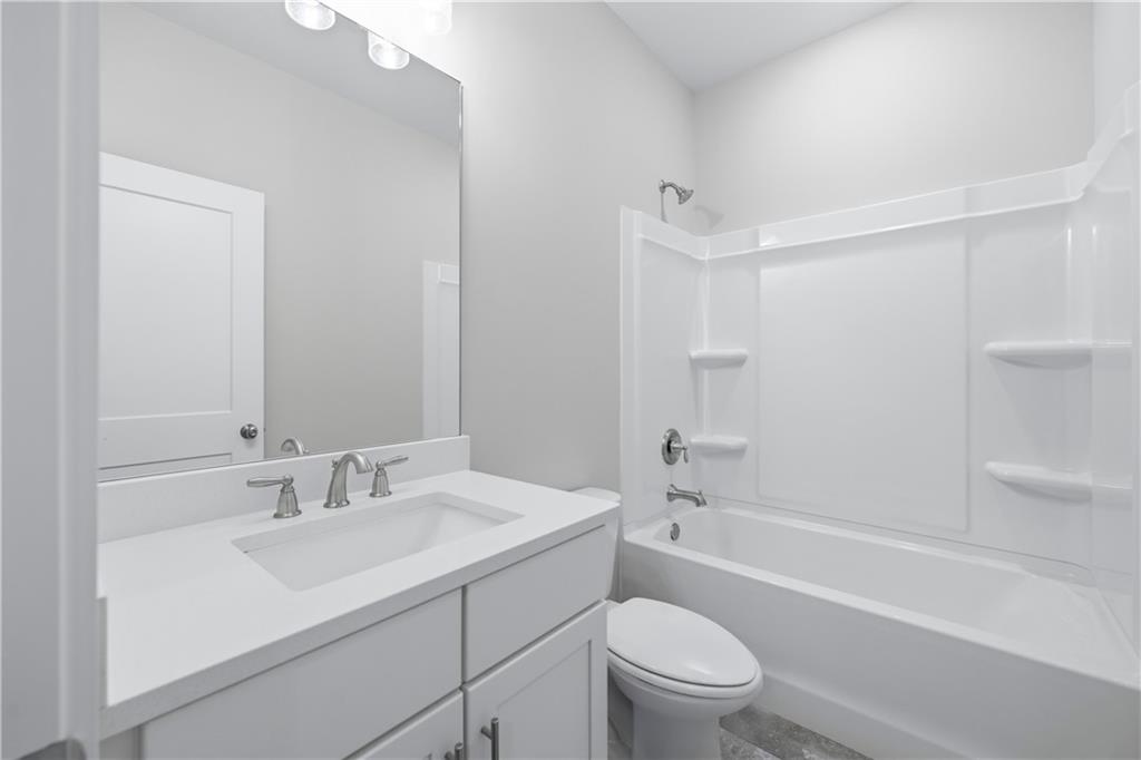 5706 Meadow View Drive Jefferson, GA 30549 - Photo 33 of 47 a bathroom with a sink a toilet and shower