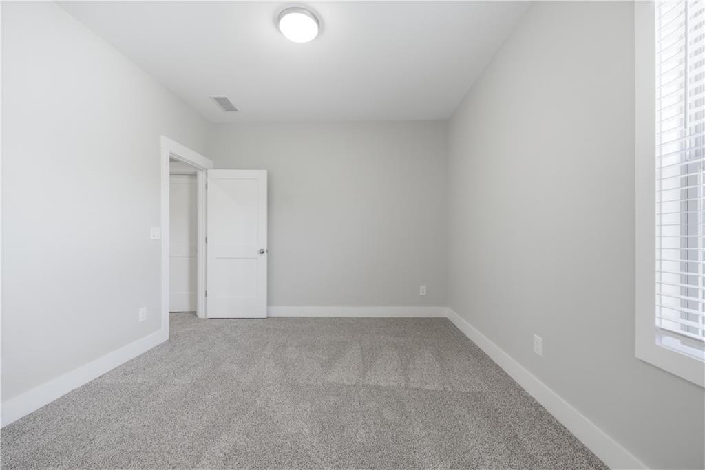 5706 Meadow View Drive Jefferson, GA 30549 - Photo 37 of 47 an empty room with a window