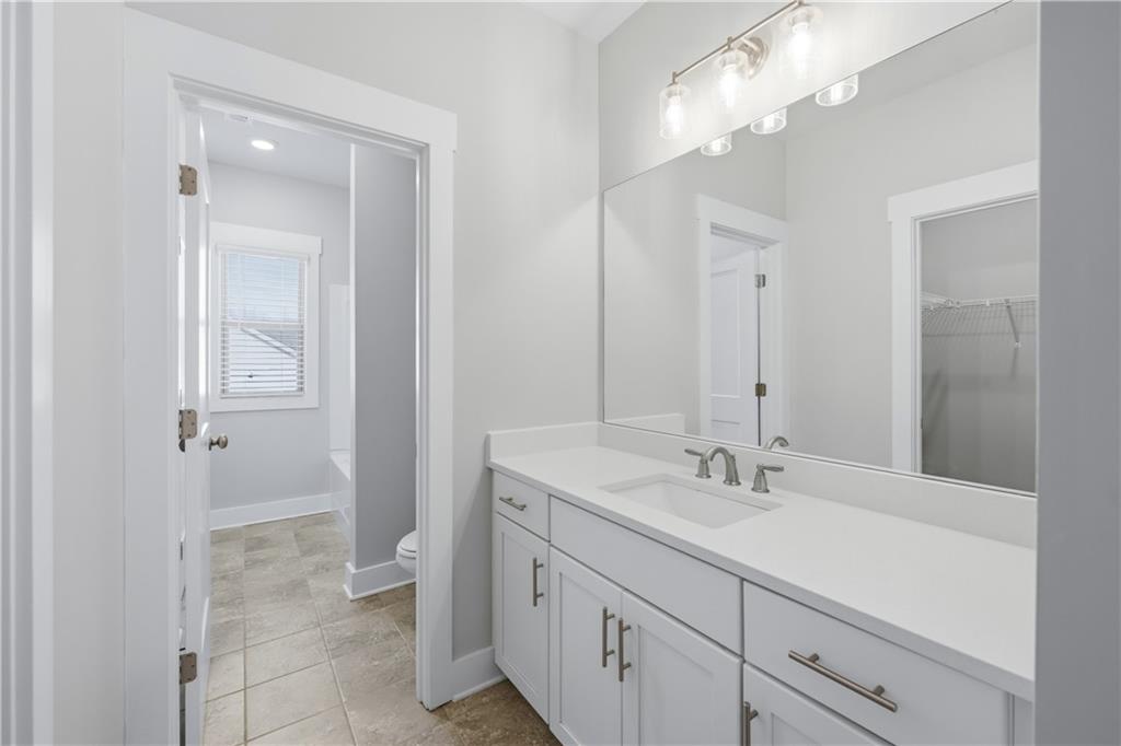 5706 Meadow View Drive Jefferson, GA 30549 - Photo 39 of 47 a bathroom with a double vanity sink and a mirror