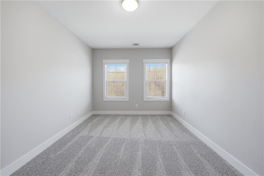 5706 Meadow View Drive Jefferson, GA 30549 - Photo 42 of 47 an empty room with windows