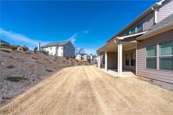 a view of a house with a snow in the background