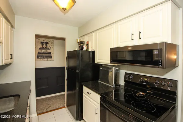 a kitchen with a stove and a microwave