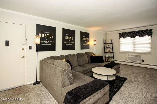 a living room with furniture and a table