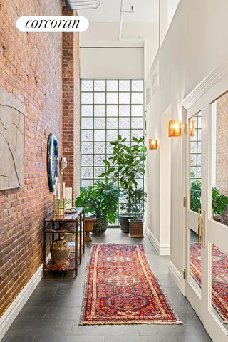 a kitchen with kitchen island white cabinets and stainless steel appliances