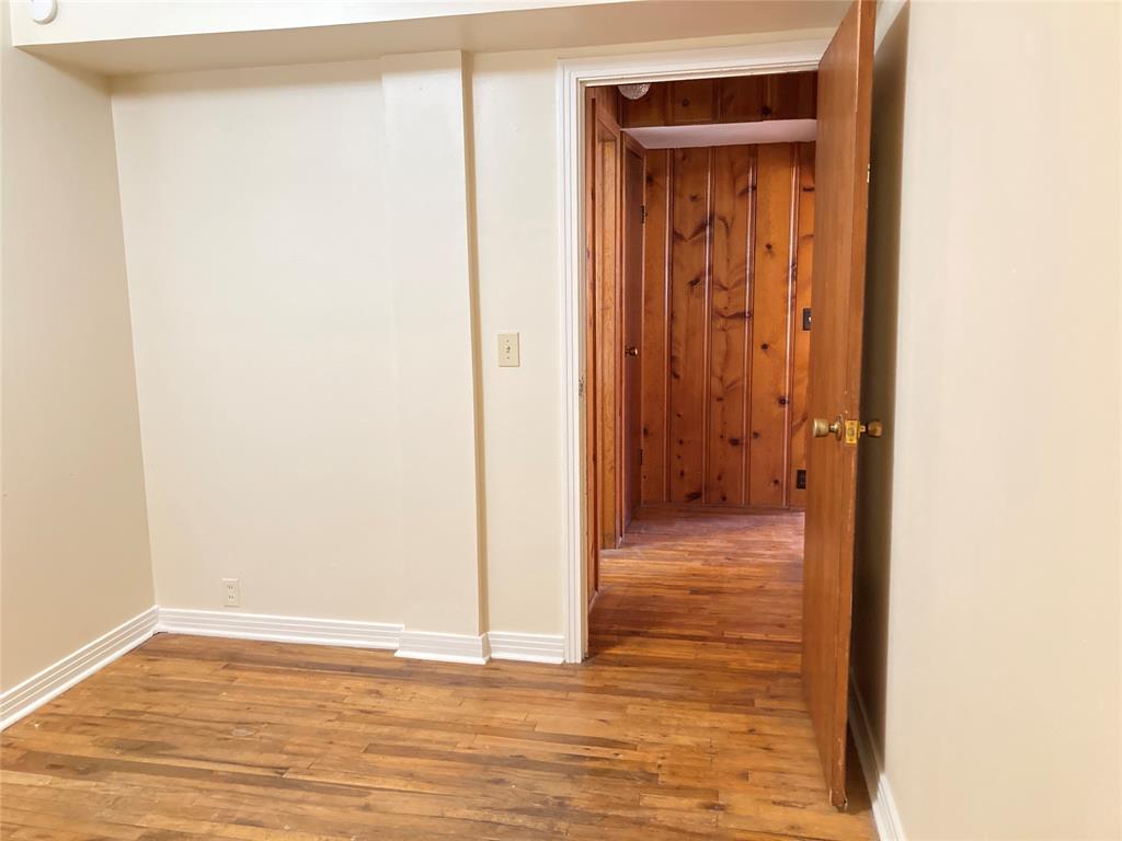 11655 Randle Lane Fort Worth, TX 76179 - Photo 25 of 35 a view of a hallway with wooden floor
