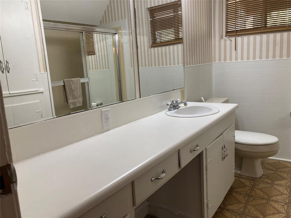 11655 Randle Lane Fort Worth, TX 76179 - Photo 26 of 35 a bathroom with a sink and a toilet