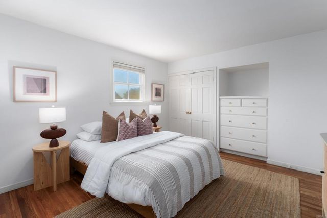 a bedroom with a bed and a closet