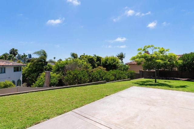 a view of a golf course with a garden
