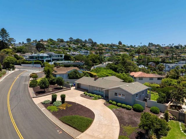 an aerial view of residential houses and outdoor space