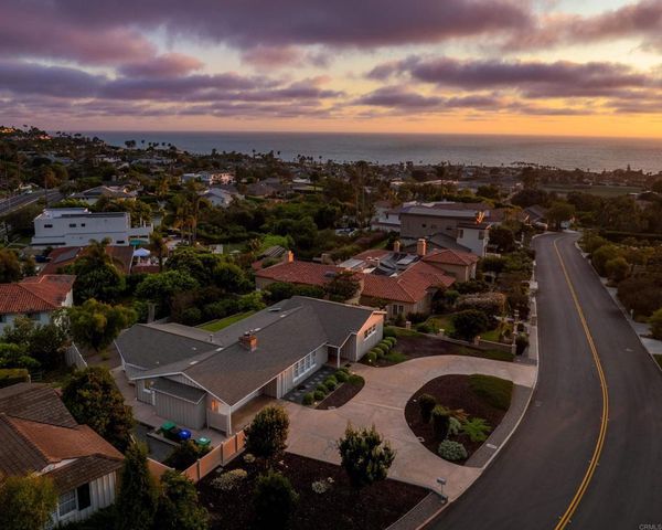 an aerial view of a house with outdoor space