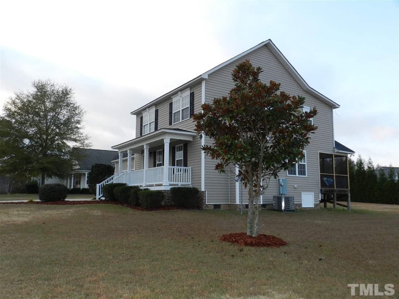 453 Axum Road Willow Spring, NC 27592 - Photo 2 of 17 a front view of a house with a yard